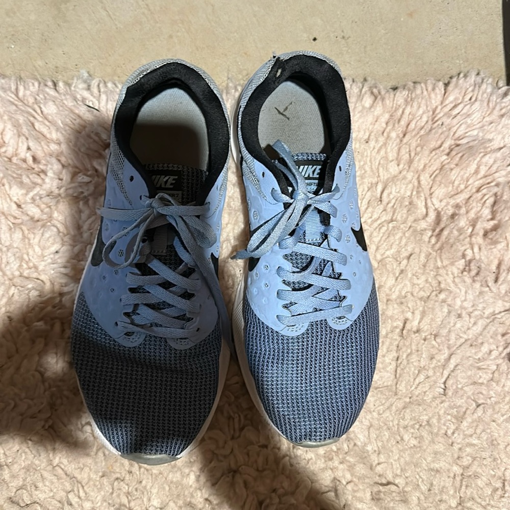Blue Nike tennis shoes